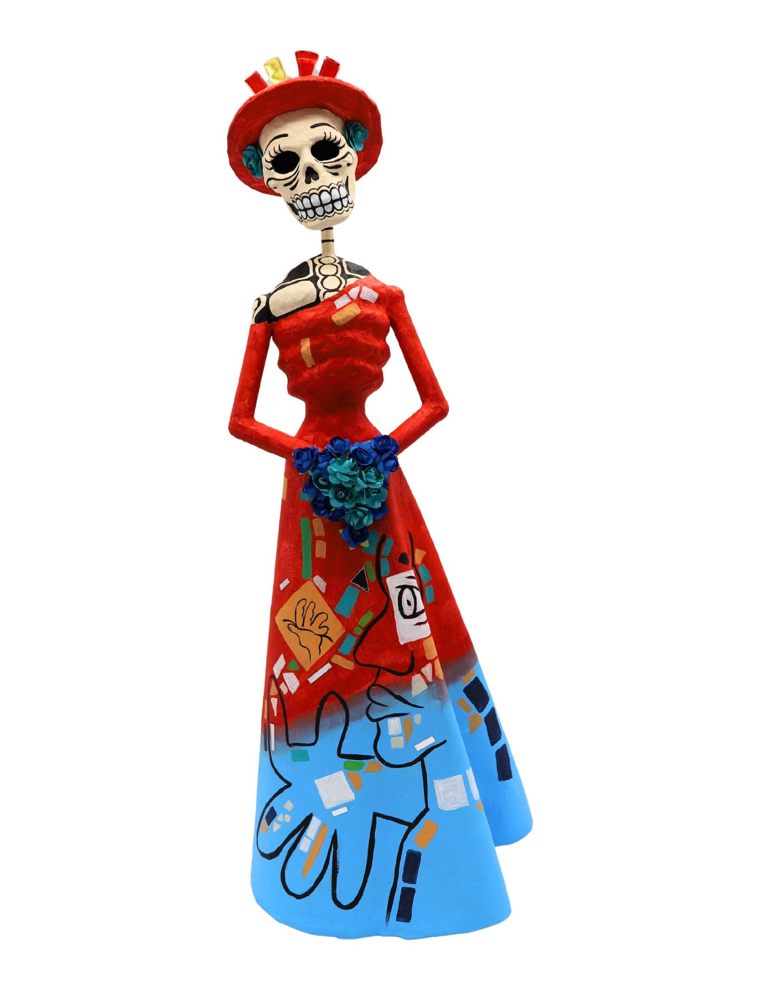 A papier-mâché skeleton figurine wearing a red dress and hat with blue and multicolor painted details.
