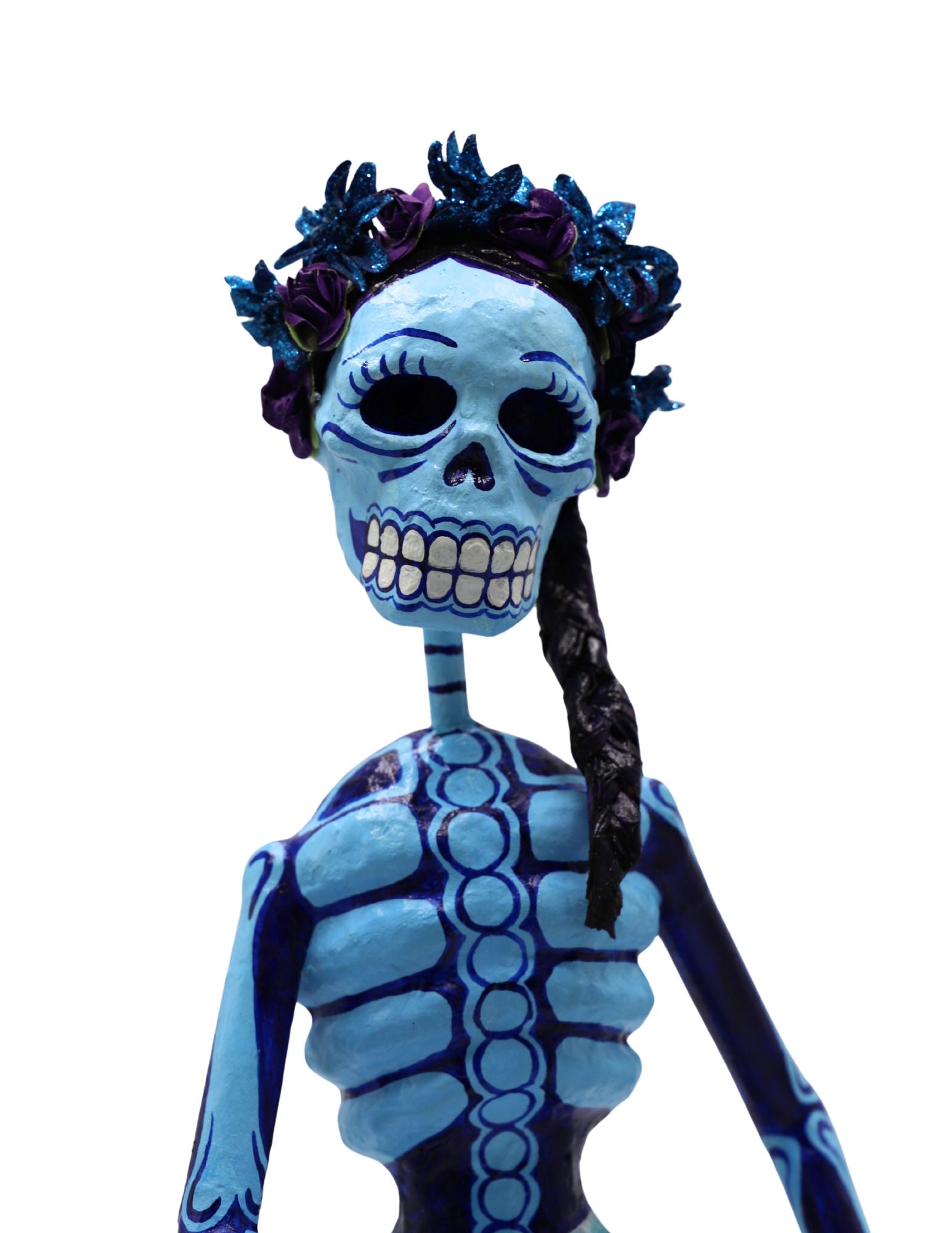 A papier-mâché figurine painted in light blue and dark blue, featuring a floral crown and a long black braid.