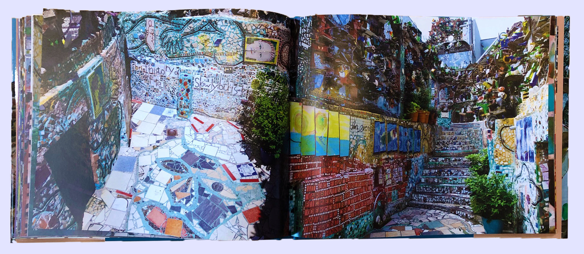 Open book with full-page images of the Magic Gardens Museum