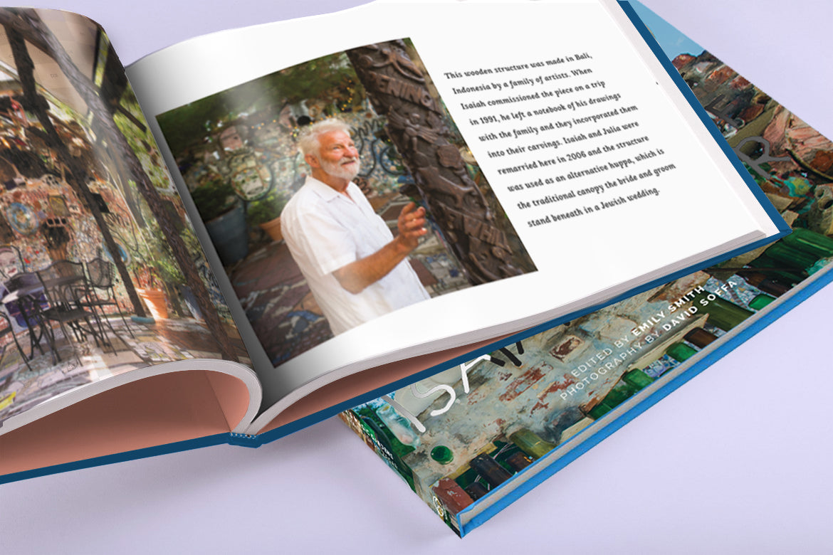 Open book with a photo of a Isaiah Zagar