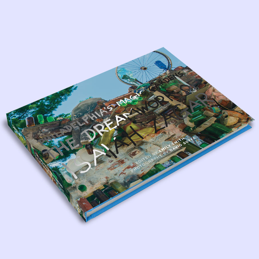 Book titled 'Philadelphia's Magic Gardens: The Dreamwork of Isaiah Zagar"' with colorful cover design 