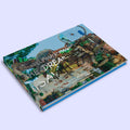 Book titled 'Philadelphia's Magic Gardens: The Dreamwork of Isaiah Zagar"' with colorful cover design 