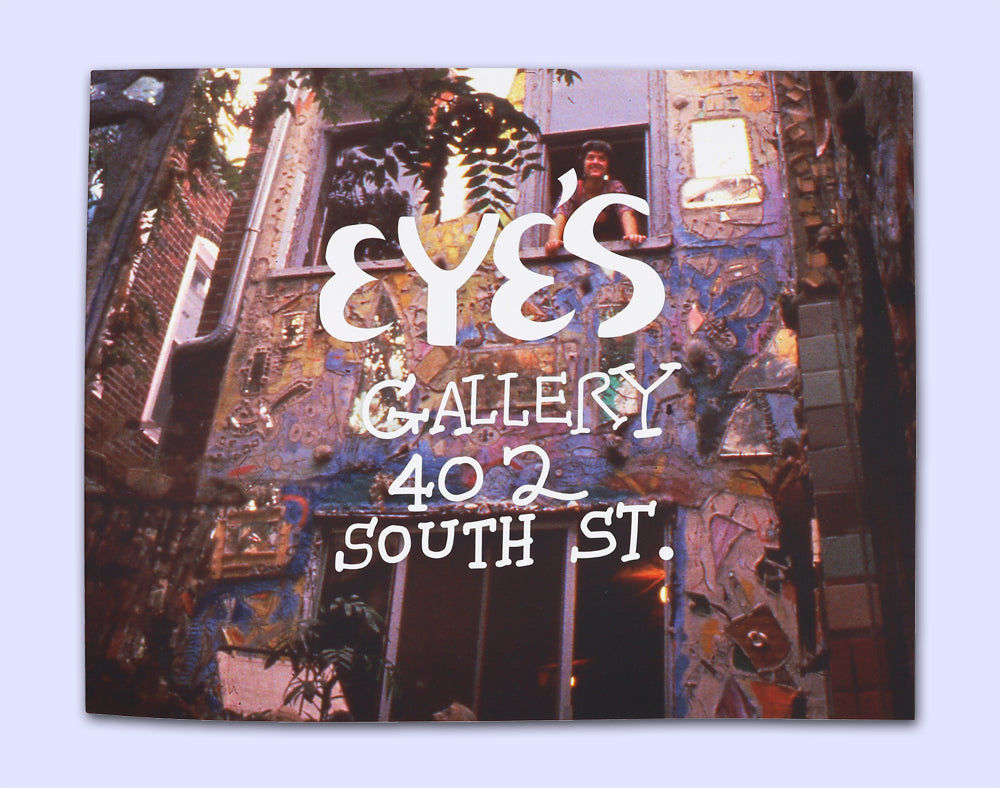 Cover of  'EYES Gallery 402 South St.' book with Julia Zagar standing in the window of a mosaicked wall. 