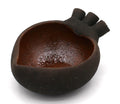 Ceramic heart-shaped dish with black exterior and brown interior. Handmade in Mexico. Measures 1.5" x 2.75" x 3.25"