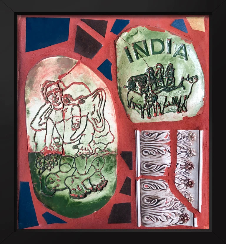 Mosaic panel with a tile stamped with the word 'India,' a Ganesh tile, and other decorative elements on a red background.