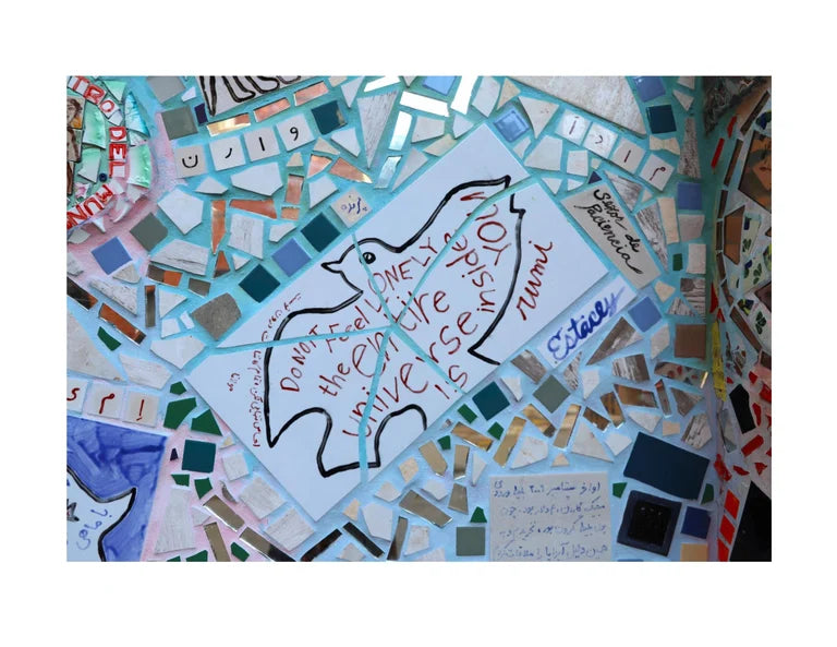 Image of a mosaic of a bird. Words read "Don't feel lonely, the entire universe is inside you -Rumi"