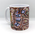 11 oz. ceramic coffee mug featuring an image of the "Philadelphia" mosaic by Isaiah Zagar and Philadelphia's Magic Gardens logo.