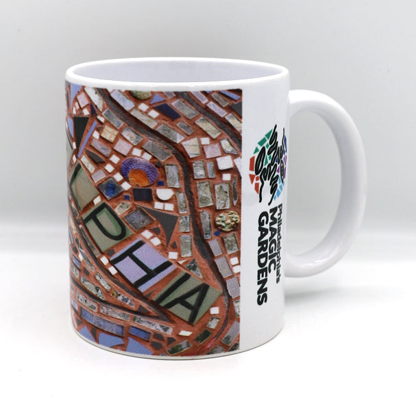 11 oz. ceramic coffee mug featuring an image of the "Philadelphia" mosaic by Isaiah Zagar and Philadelphia's Magic Gardens logo.