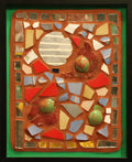 Framed mosaic with several round tiles on an orange background with a green border.