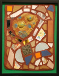 Framed mosaic with colorful tiles on brownish grout and a green border.