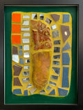 Framed mosaic with colorful tile and mirror pieces on yellow grout with a green border.