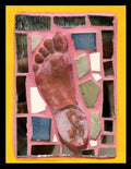 Mosaic artwork of a foot with colorful tiles on pink grout with a yellow border.