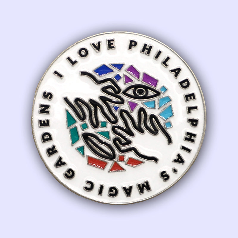 Circular enamel pin (1.25"x1.25") featuring PMG's logo. Rubber clutch included.