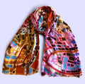 Colorful lightweight scarf with a mosaic pattern.