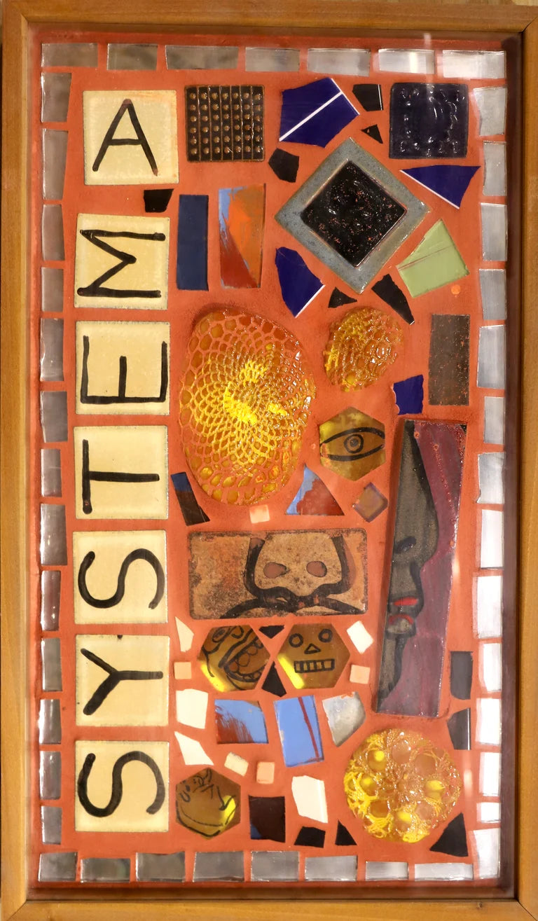 Framed mosaic mural with colorful tiles and the words "system A" on orange grout.