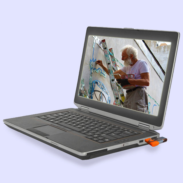 Laptop with a screen displaying Isaiah Zagar mosaicking.