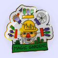 Enamel pin (1.25"x1.25") featuring a colorful, original drawing of and by PMG founding artist Isaiah Zagar.